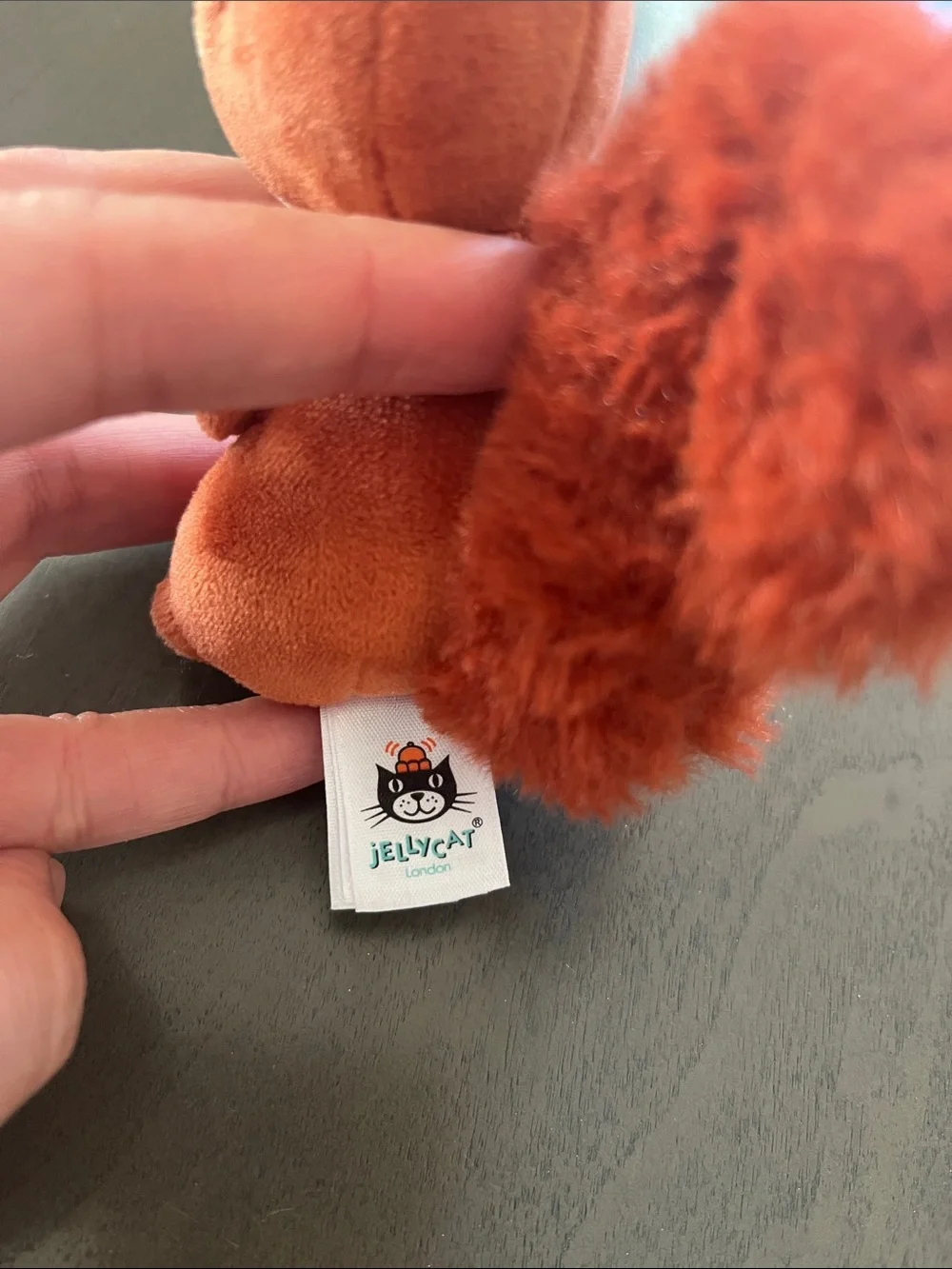 Jellycat Orange Squirrel with Fluffy Tail in Navy Plush Nest